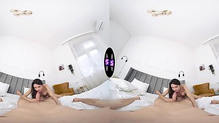 A long-haired brunette with natural tits fucks in missionary position