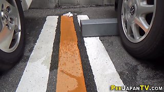 Kinky asian pees on the street