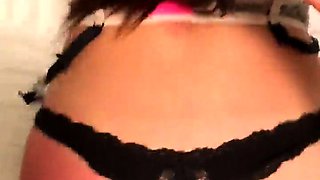 Amateur Asian babe sucks a lolly as she rubs her pussy