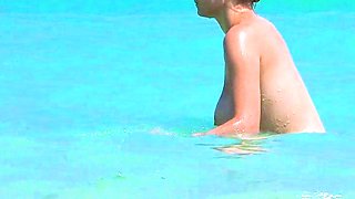 Smoothest nudist play in the warm water  at a nudist beach