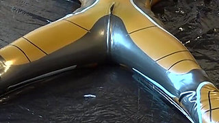 Latex Danielle is attached to the bed and masturbated with the massage vibrator