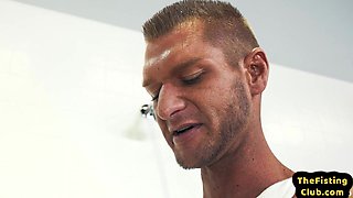 Fisting Black hunk fucks skinny asshole with fist and feet