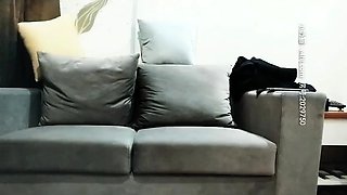 Cute amateur asian web cam girl playing with her toy