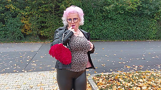Naughty Granny Tongue Out Flashing Big Tits in Public