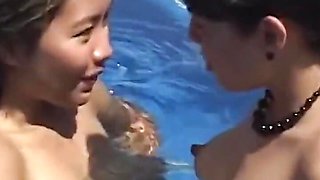A Couple of Horny Asian Lesbian Brunettes Lick Each Other in the Pool