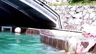 Two horny lesbians masturbate with toys outdoor by the pool