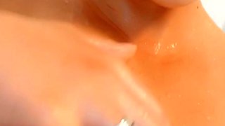 Hot babe with perfect big boobs taking shower