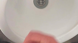 Moaning daddy has a lot of pressure and milks his cock in the public toilet