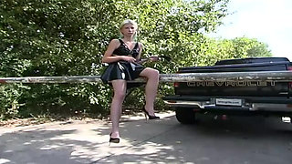Outdoor - Latex blondie walks around and presents her fetish outfit