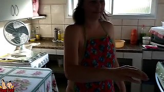 Nudist housewife making a cake