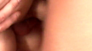 Chick gags on two large cocks on table