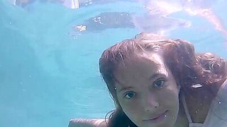 Petite Russian beauty Katya Clover showing her shaved pussy under the water