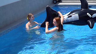 Lesbian Girls Are Having Fun in a Pool with an Inflatable Shark