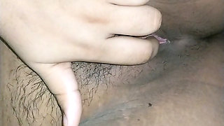 cute girl on sofa fingering pink pussy