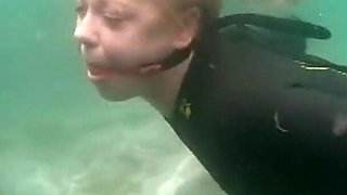 Ocean Rope Bondage with Ballgag in Wetsuit